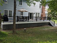 <b>Trex Transcend Island Mist Decking with Ultralox Black Aluminum Railing and Gray Vinyl Lattice underneath deck in Ellicott City MD</b>